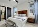 Relaxing bedroom with neutral tones, wood headboard, and soft accent lighting at 3436 W 154Th Ave, Broomfield, CO 80023