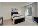 Cozy bedroom with bright window, dark furniture, and soft, neutral carpet at 3436 W 154Th Ave, Broomfield, CO 80023