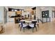 Bright dining room featuring modern chandelier, round table, and hardwood floors in a contemporary home at 3436 W 154Th Ave, Broomfield, CO 80023