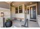 Covered front porch with seating and stylish entryway at 3436 W 154Th Ave, Broomfield, CO 80023