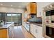 Modern kitchen with high-end appliances, island with seating, sleek countertops and lots of natural light at 3436 W 154Th Ave, Broomfield, CO 80023