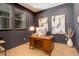 Well-lit office space with wood floors and contemporary artwork at 3436 W 154Th Ave, Broomfield, CO 80023