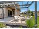 Relaxing outdoor patio with stone pillars, pergola, modern seating and beautiful views for entertaining at 3436 W 154Th Ave, Broomfield, CO 80023