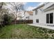 Backyard view featuring a well-maintained lawn, wooden fence, and partial view of neighboring homes at 4264 Thorndyke Pl, Broomfield, CO 80020