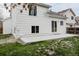 Exterior view of backyard with a concrete patio, grassy area, and white siding on the house at 4264 Thorndyke Pl, Broomfield, CO 80020