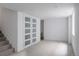 Large basement space featuring carpeted floors, glass doors, and recessed lighting at 4264 Thorndyke Pl, Broomfield, CO 80020