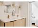Modern bathroom with double vanity, updated fixtures, lighting, and mirrors at 4264 Thorndyke Pl, Broomfield, CO 80020