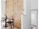 Dining area with wood slat partition, seamlessly transitioning to the next space at 4264 Thorndyke Pl, Broomfield, CO 80020