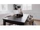Bright dining room with white walls and dark wood table with seating for six at 4264 Thorndyke Pl, Broomfield, CO 80020