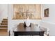 Dining area with a dark wood table and modern chairs set against a slatted partition at 4264 Thorndyke Pl, Broomfield, CO 80020
