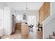 Bright modern kitchen featuring an island with seating, stainless steel appliances, and light wood floors at 4264 Thorndyke Pl, Broomfield, CO 80020