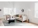 Bright and airy living room with comfortable seating and a large window at 4264 Thorndyke Pl, Broomfield, CO 80020