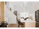Open living space with a kitchen island, flowing into the living room area at 4264 Thorndyke Pl, Broomfield, CO 80020