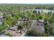This aerial view shows the property nestled within a serene neighborhood near a lake at 449 S Humboldt St, Denver, CO 80209