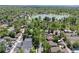 Serene aerial view of the house surrounded by trees and conveniently located near a tranquil lake at 449 S Humboldt St, Denver, CO 80209