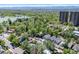 Scenic aerial view of the house in a neighborhood near a lake and green park areas at 449 S Humboldt St, Denver, CO 80209