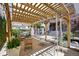 Backyard featuring a pergola with seating and a swing for relaxing and entertaining outdoors at 449 S Humboldt St, Denver, CO 80209