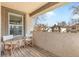 Inviting balcony with two chairs, offering a relaxing outdoor space with views of the surrounding neighborhood at 449 S Humboldt St, Denver, CO 80209