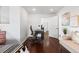 Bright bedroom area with hardwood floors, a work desk, a decorative chair, and a neutral color palette at 449 S Humboldt St, Denver, CO 80209