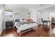 Bright bedroom with hardwood floors, featuring a comfortable bed, modern decor, and great natural light at 449 S Humboldt St, Denver, CO 80209