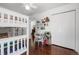 Bedroom featuring a bunkbed, wood floor, desk, and closet with white paneled doors at 449 S Humboldt St, Denver, CO 80209