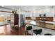 Bright kitchen features stainless steel appliances, granite countertops, and a brick backsplash at 449 S Humboldt St, Denver, CO 80209