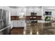 Bright kitchen with brick backsplash, stainless steel appliances, and an island with a granite countertop at 449 S Humboldt St, Denver, CO 80209