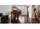 Elegant living room featuring polished hardwood floors, a wood burning fireplace, and large windows at 449 S Humboldt St, Denver, CO 80209