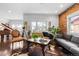 Bright living space featuring hardwood floors, exposed brick, and stylish contemporary furnishings at 449 S Humboldt St, Denver, CO 80209