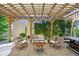 Inviting outdoor patio featuring a pergola, comfortable seating, and greenery for a relaxing atmosphere at 449 S Humboldt St, Denver, CO 80209