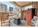 Cozy covered patio with a fireplace, ample seating, and city views at 449 S Humboldt St, Denver, CO 80209