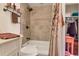 This bathroom shows a tiled shower and a white vanity with cabinet space at 13635 E Bates Ave # 406, Aurora, CO 80014