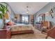 Bedroom with hardwood floors, natural light, and stylish decor providing a peaceful personal space for rest at 13635 E Bates Ave # 406, Aurora, CO 80014