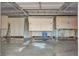 The interior of a garage featuring storage units, a concrete floor, and metal ceiling at 13635 E Bates Ave # 406, Aurora, CO 80014