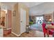 Open-concept space with seamless flow from living to dining featuring hardwood floors and natural light at 13635 E Bates Ave # 406, Aurora, CO 80014