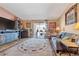 Living room with large window, comfortable seating and plenty of natural light at 13635 E Bates Ave # 406, Aurora, CO 80014
