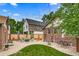 Private backyard oasis with patio, fire pit, and lush landscaping at 840 S Corona St, Denver, CO 80209