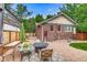 Charming backyard featuring a stone patio, fire pit, and comfortable seating at 840 S Corona St, Denver, CO 80209