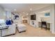 Finished basement with a comfortable seating area and functional desk nook at 840 S Corona St, Denver, CO 80209