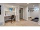 Basement with built-in desk, shelving, and a doorway leading to a flexible workout space at 840 S Corona St, Denver, CO 80209
