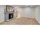 Basement room with gray fireplace, wood stove insert, neutral carpet, and ample space at 840 S Corona St, Denver, CO 80209