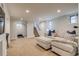 Spacious basement with a comfortable seating area, desk, and stairs leading to the upper level at 840 S Corona St, Denver, CO 80209