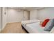 Basement bedroom features a comfortable bed, soft pillows, and cozy, warm decor at 840 S Corona St, Denver, CO 80209