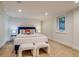 Basement bedroom with plush bed, seating and recessed lighting for a cozy and inviting space at 840 S Corona St, Denver, CO 80209