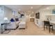 Finished basement area with cozy seating, a built-in desk, and ample space for work and relaxation at 840 S Corona St, Denver, CO 80209