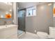 Modern bathroom features white vanity, a glass-enclosed shower, and stylish tile flooring at 840 S Corona St, Denver, CO 80209