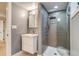 Updated bathroom featuring modern vanity, tiled walk-in shower, and neutral color palette at 840 S Corona St, Denver, CO 80209