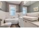 Bright bathroom featuring a soaking tub, sleek vanity, and stylish fixtures at 840 S Corona St, Denver, CO 80209