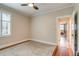 Neutral bedroom with hardwood floors, ceiling fan and view to hallway at 840 S Corona St, Denver, CO 80209