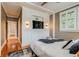 Comfortable bedroom featuring custom built-ins for media, storage and decor at 840 S Corona St, Denver, CO 80209